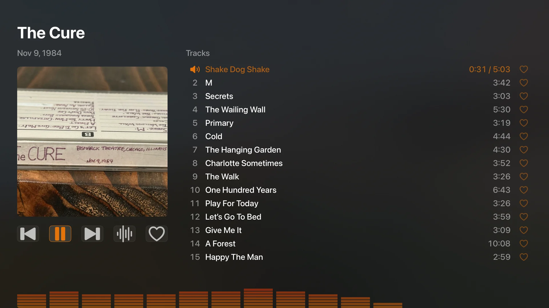 The Cure’s November 9, 1984 concert playing on Apple TV, with cassette artwork, a full track list, and the audio spectrum.
